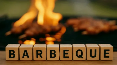 Wooden Blocks Spelling Barbeque In Front Of Flaming Grill