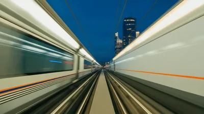 High Speed Train Passing Through Urban Cityscape