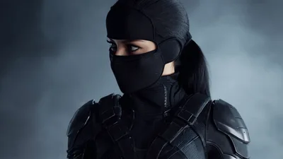 Female Ninja Warrior Looking Around In Tactical Armor