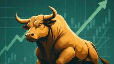 Golden Bull Statue Against Rising Stock Market Chart