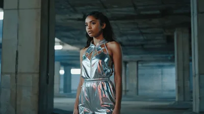 Young Woman Standing In An Abandoned Concrete Building