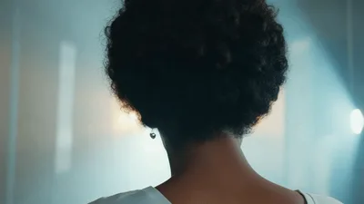 Beautiful Young Woman Turning Her Head In Studio