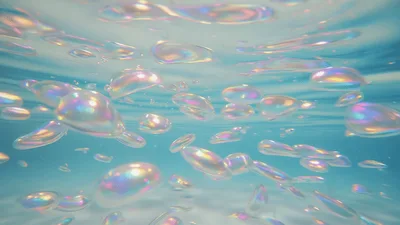 Iridescent Bubbles Floating Underwater In Clear Blue Water