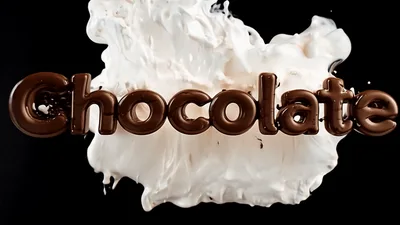 Chocolate Text Forming With Milk Splash