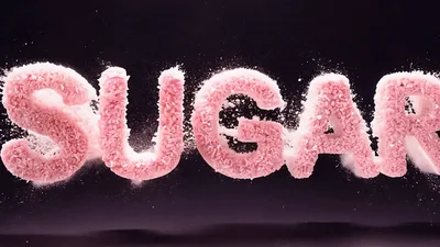 Pink Sugar Cubes Forming The Word Sugar