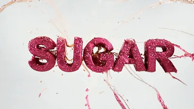 Pink Sugar Text Exploding With Liquid Splashes