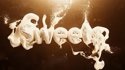 White Cream Forming The Word Sweets In Liquid