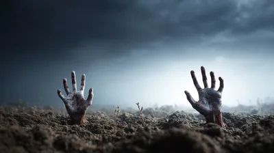 Two Bloody Zombie Hands Emerging From Dark Soil