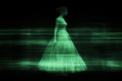 Digital Holographic Silhouette Of A Woman In A Dress