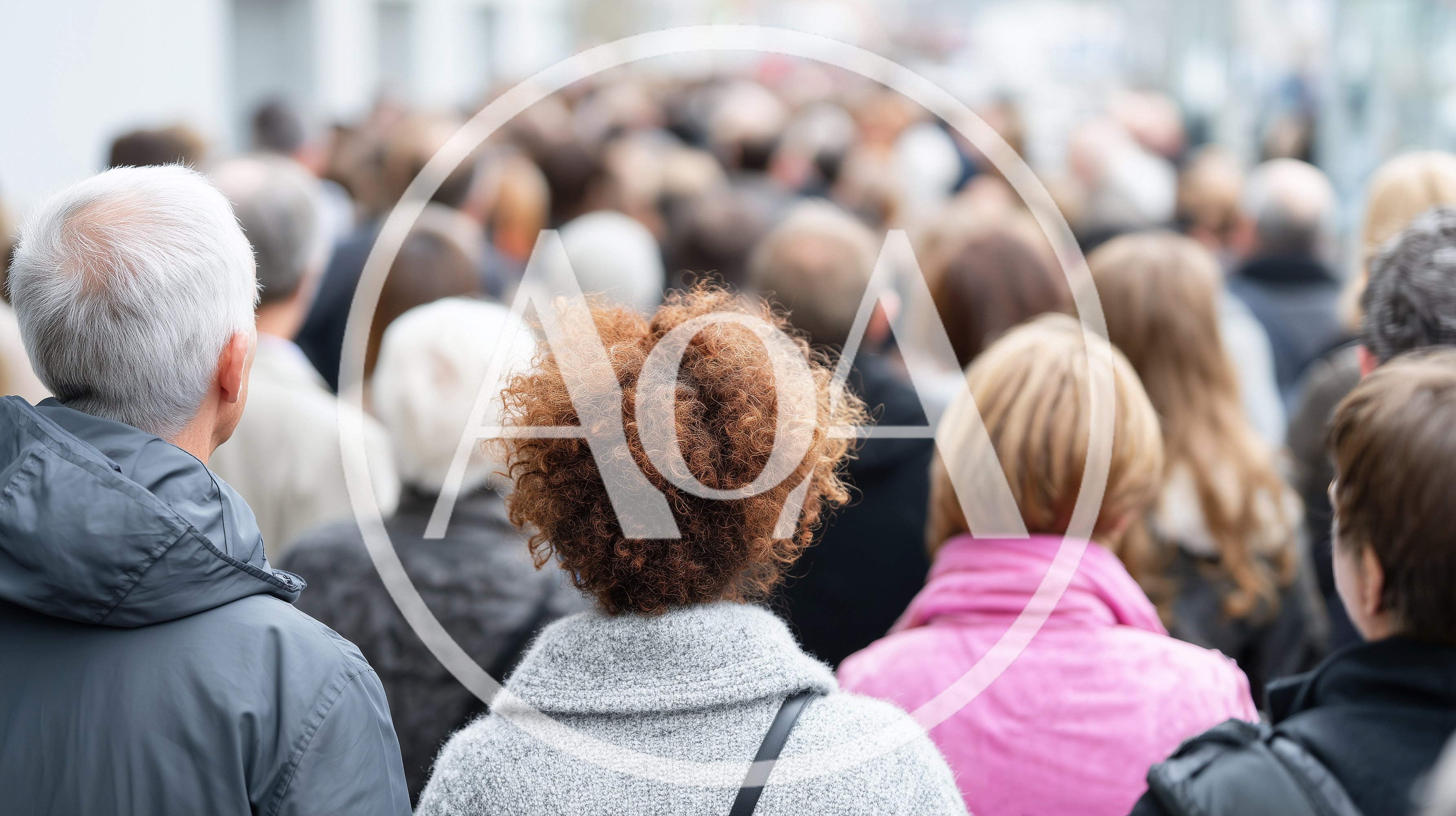 Crowd Of People Walking Down A City Street