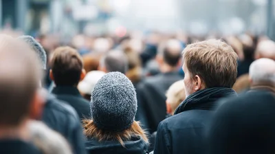 Crowd Of People Walking In A City Street