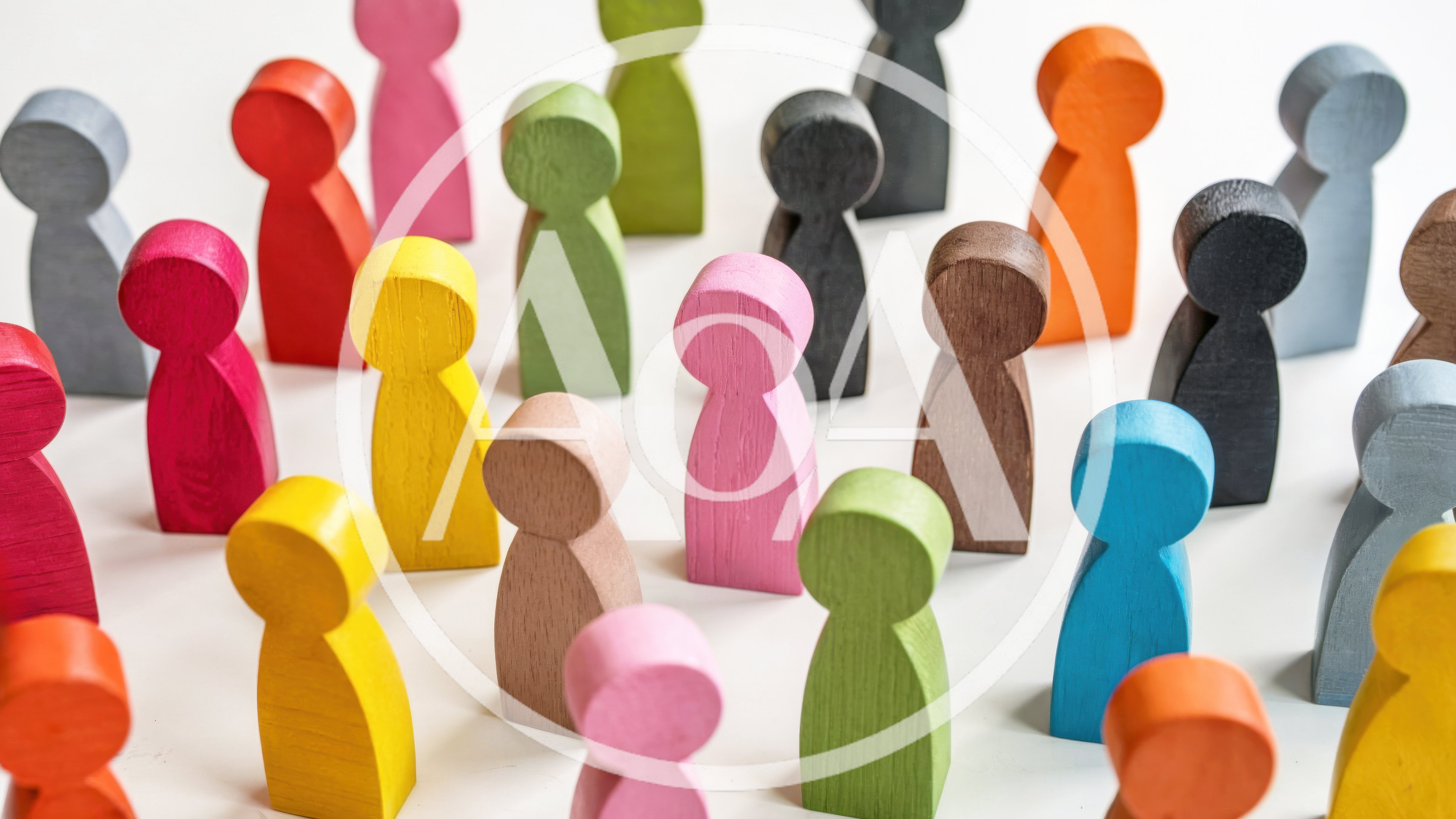 Colorful Wooden Figurines Arranged On White Surface