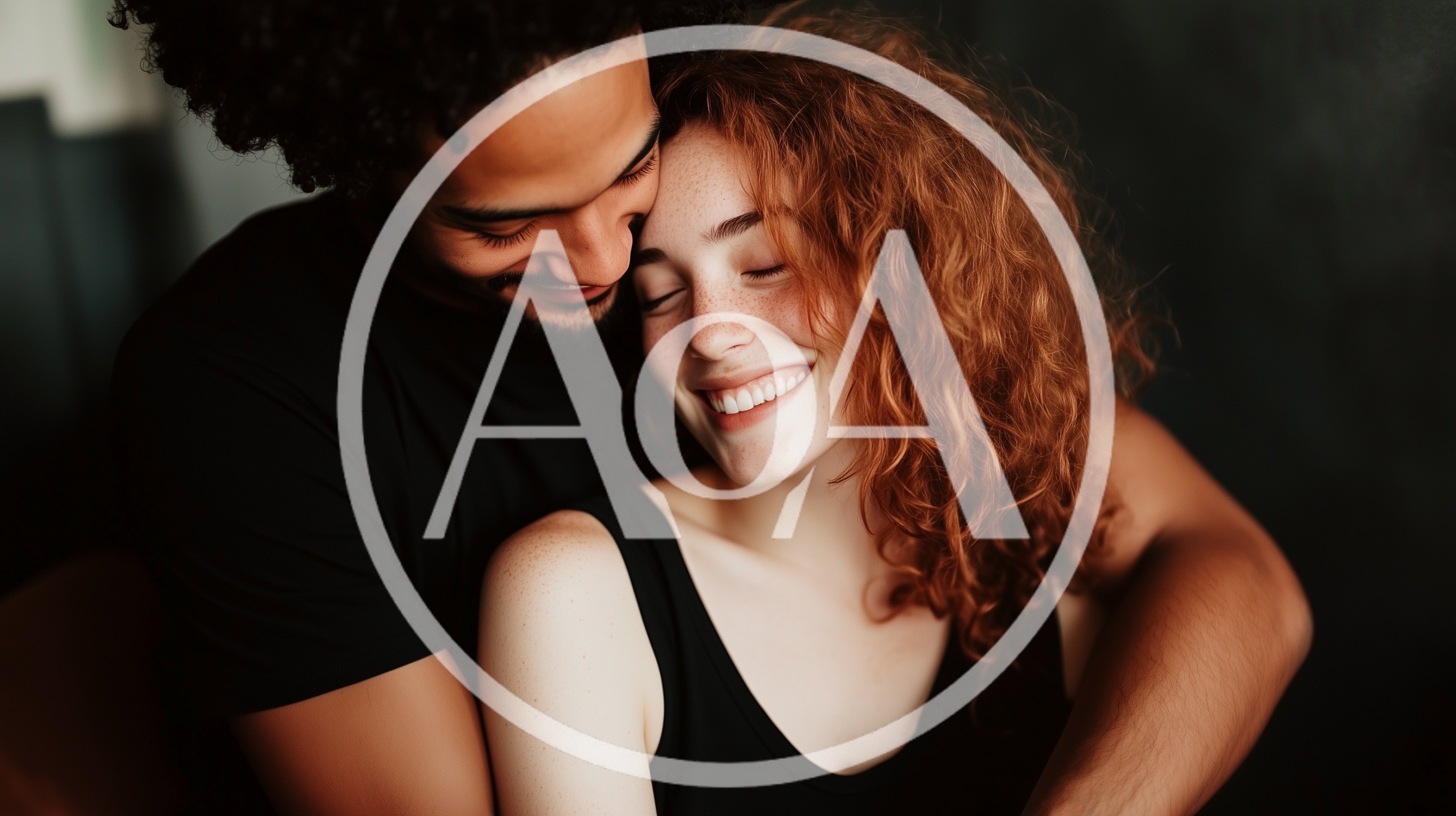 Affectionate Interracial Couple Embracing In A Dark Studio