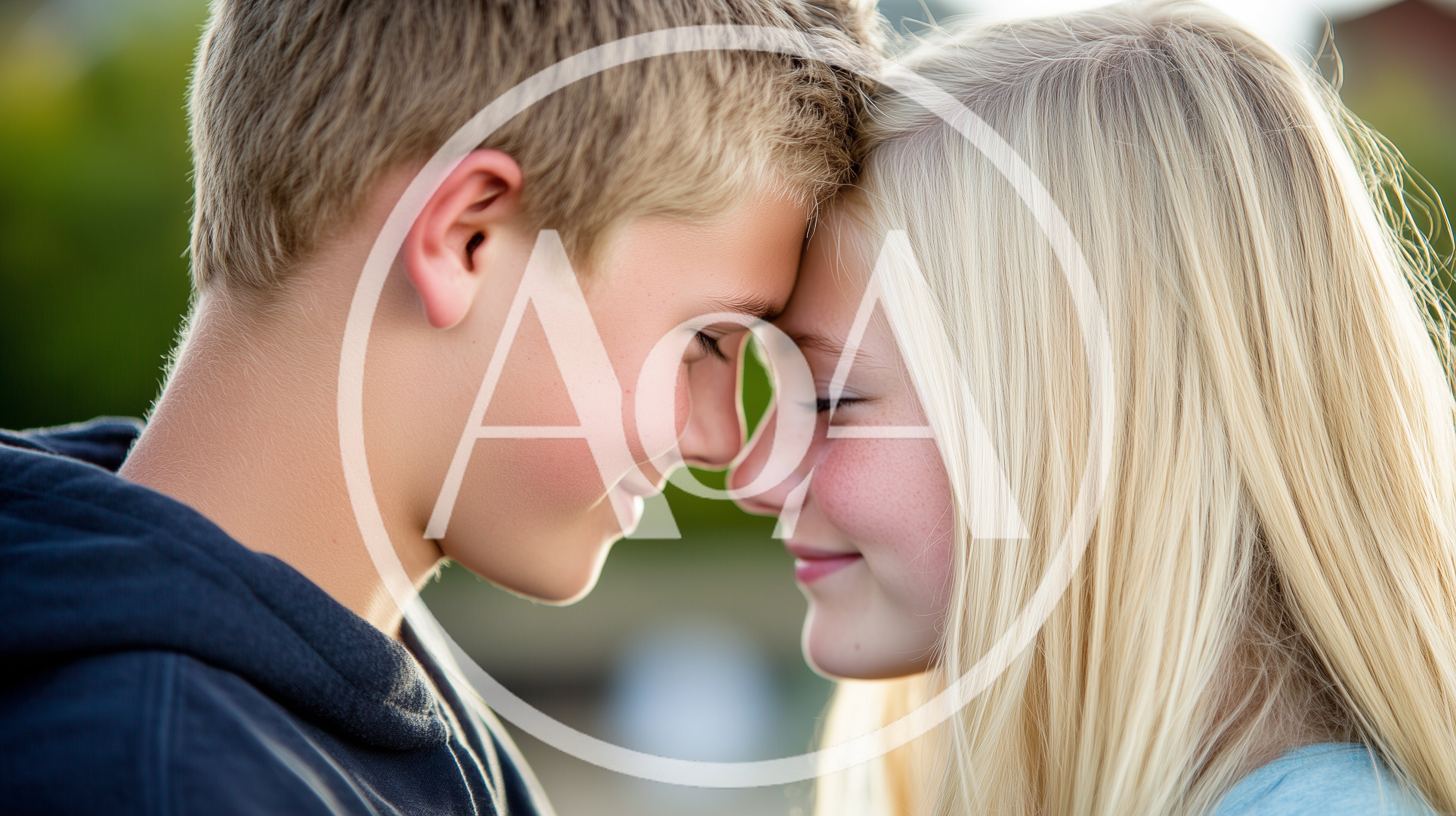 Young Couple Touching Foreheads Outdoors