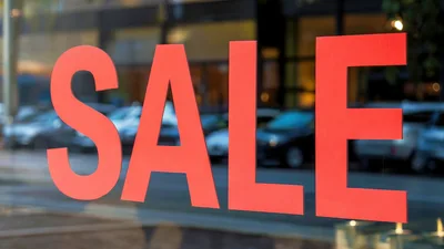 Red Sale Sign On A Store Window