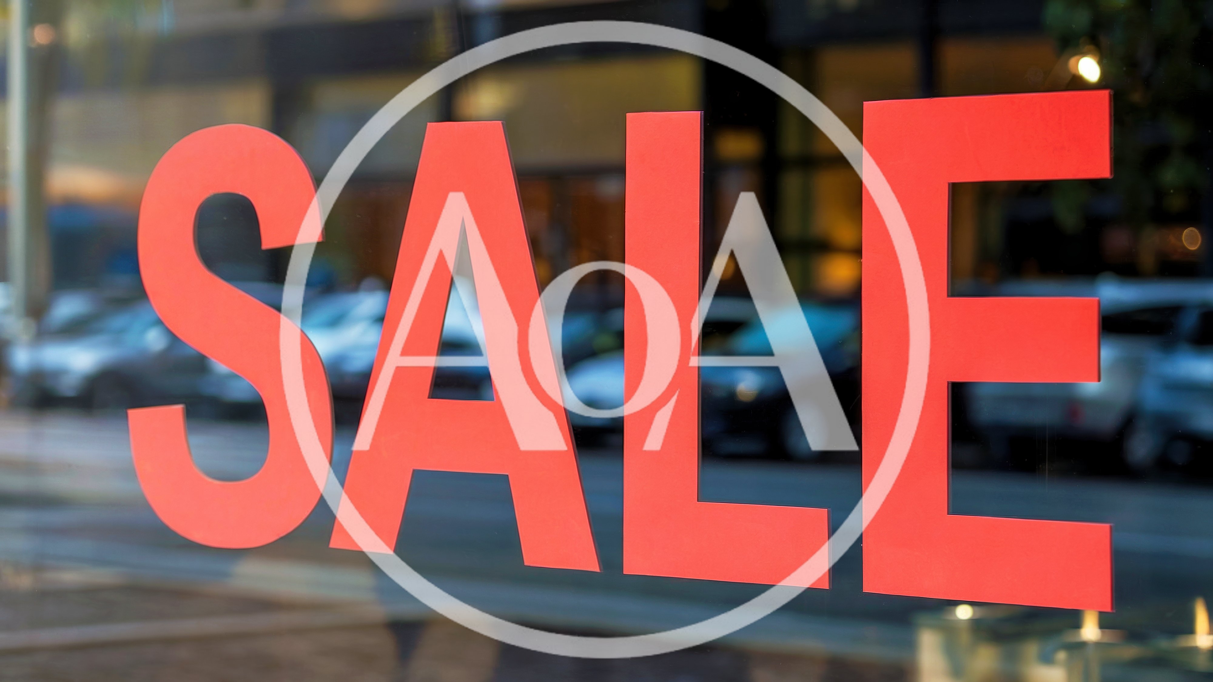 Red Sale Sign On A Store Window
