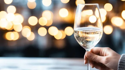 Hand Holding A Glass Of Sparkling Wine