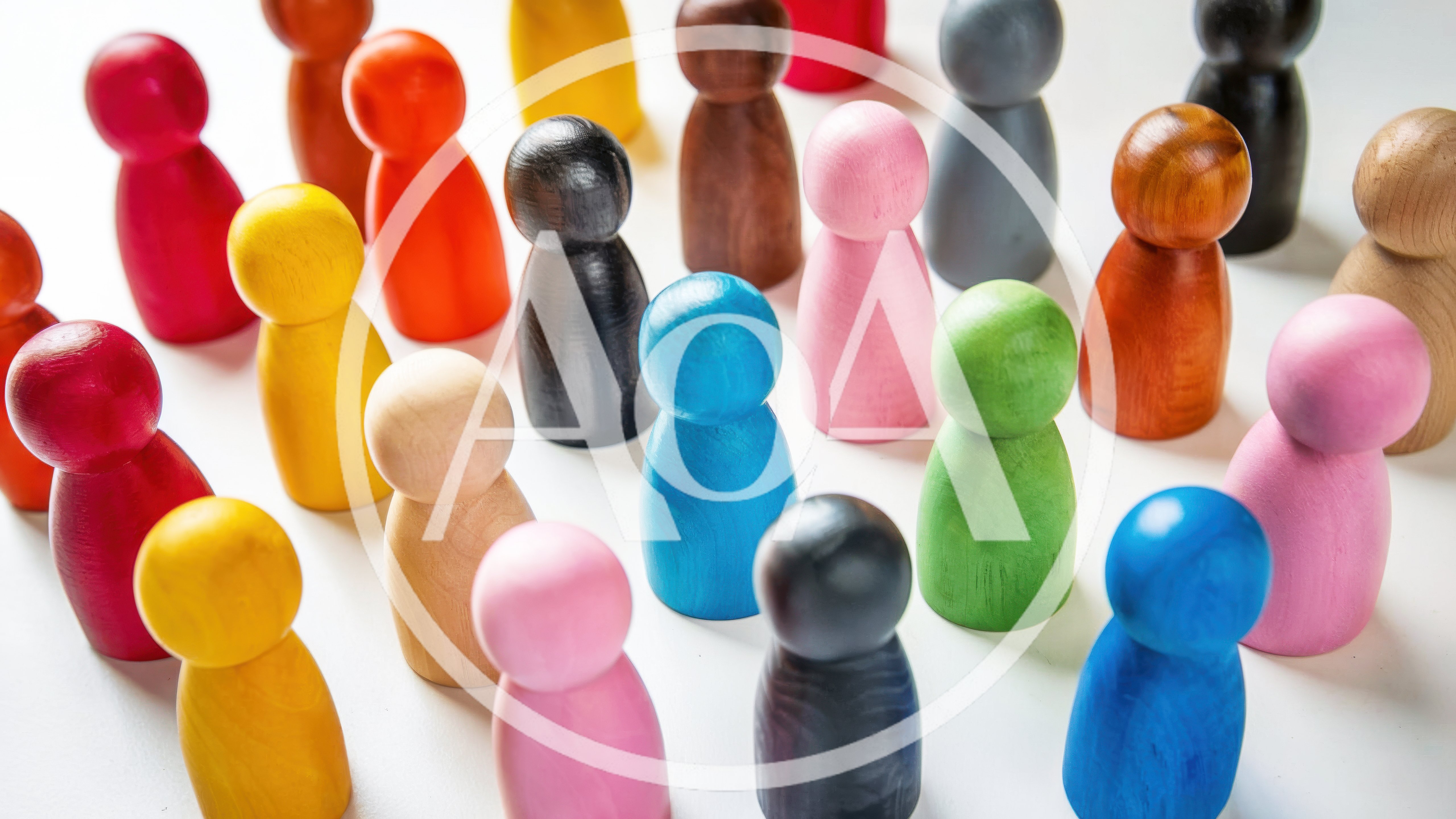 Colorful Wooden Peg People Figurines Arranged On White Surface