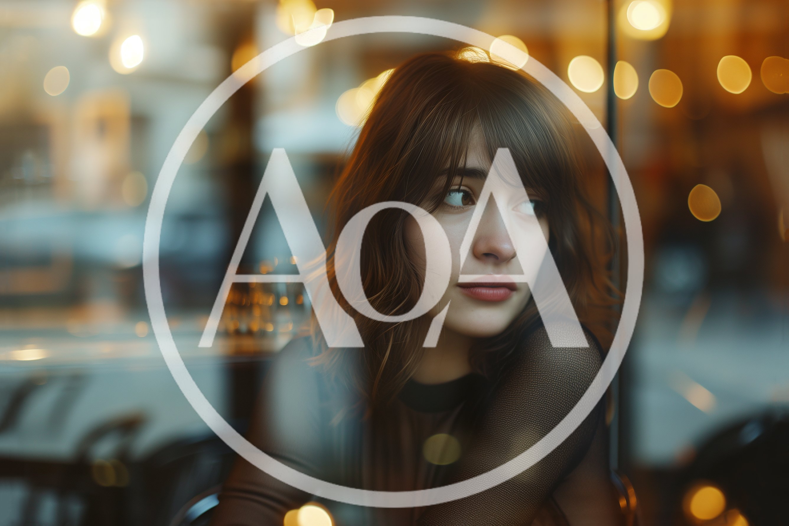 Young Woman Looking Out A Cafe Window