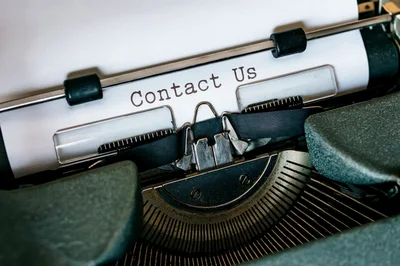 Vintage Typewriter With Contact Us Text