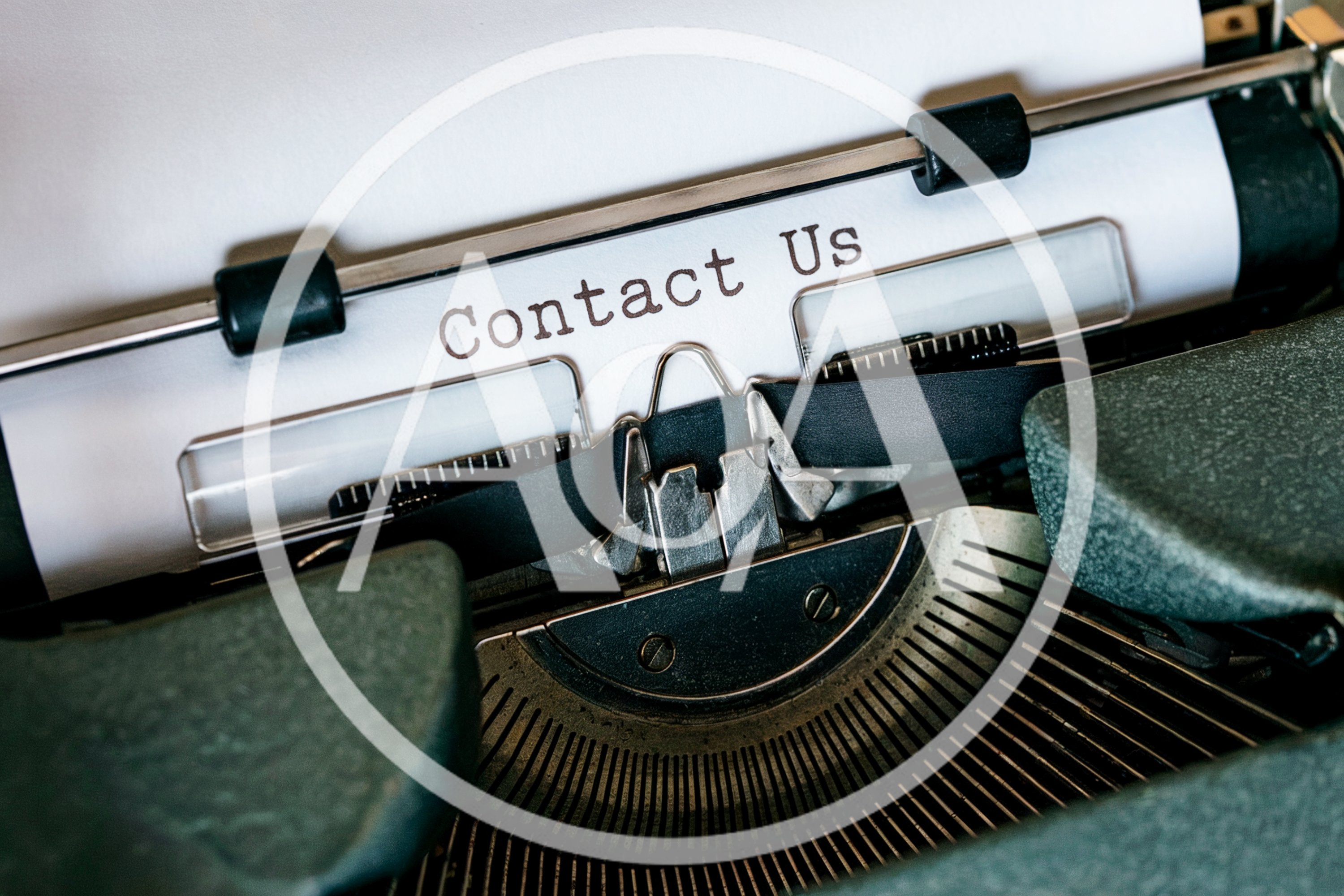 Vintage Typewriter With Contact Us Text