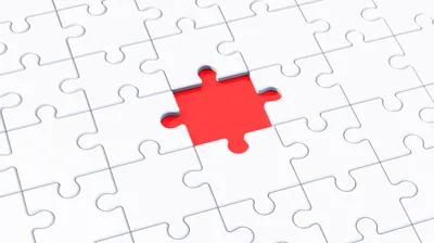 Missing Puzzle Piece Revealing Bright Red Background