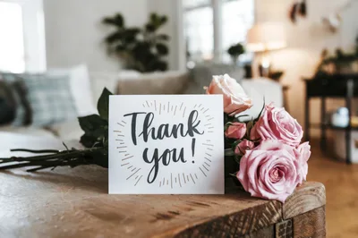 Thank You Card With Pink Roses On Wooden Table