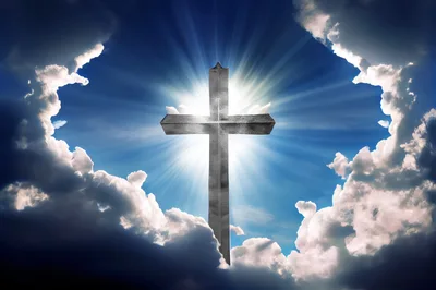 Glowing Christian Cross Against A Dramatic Blue Sky