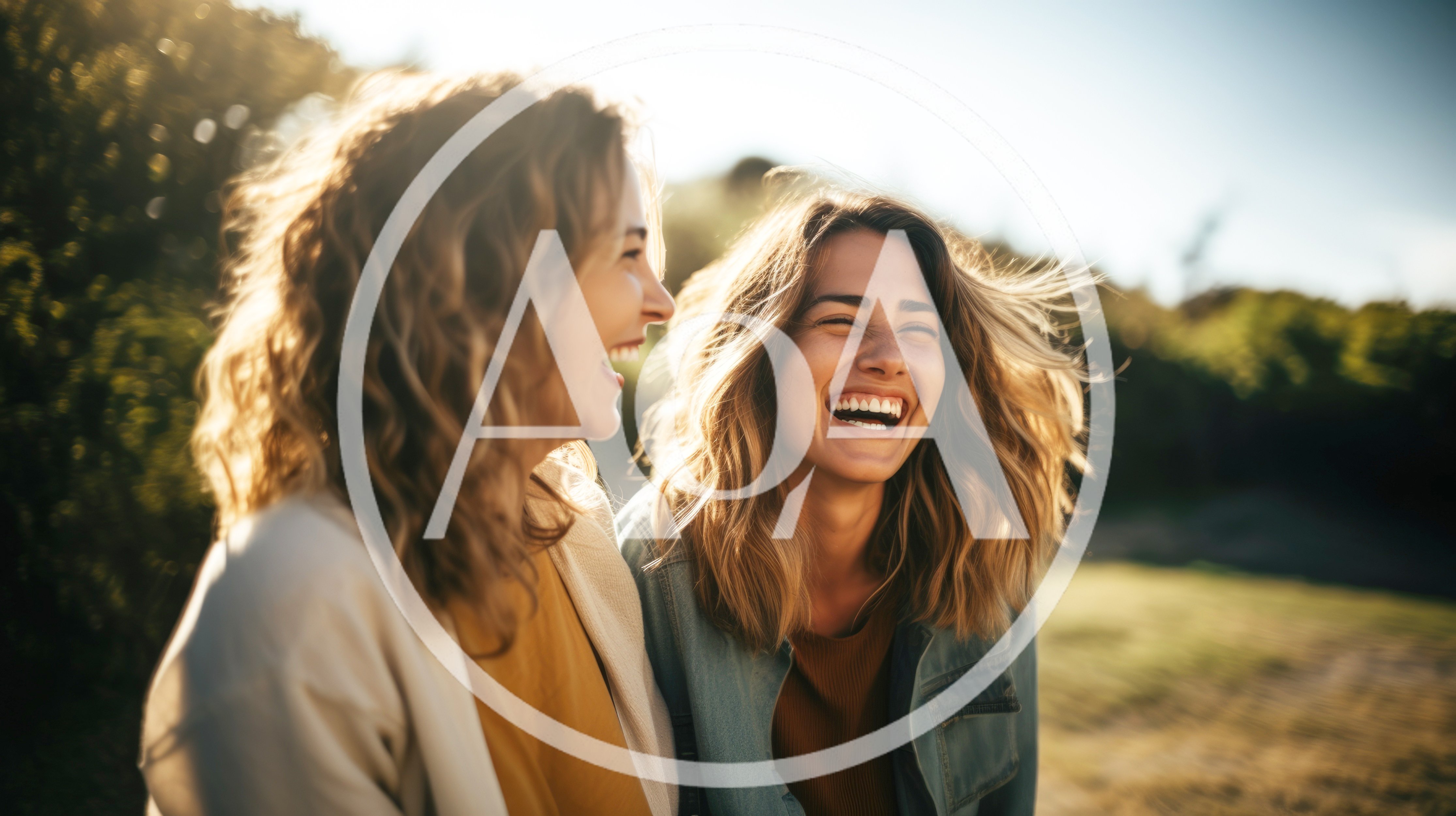 Two Happy Women Laughing Together Outdoors
