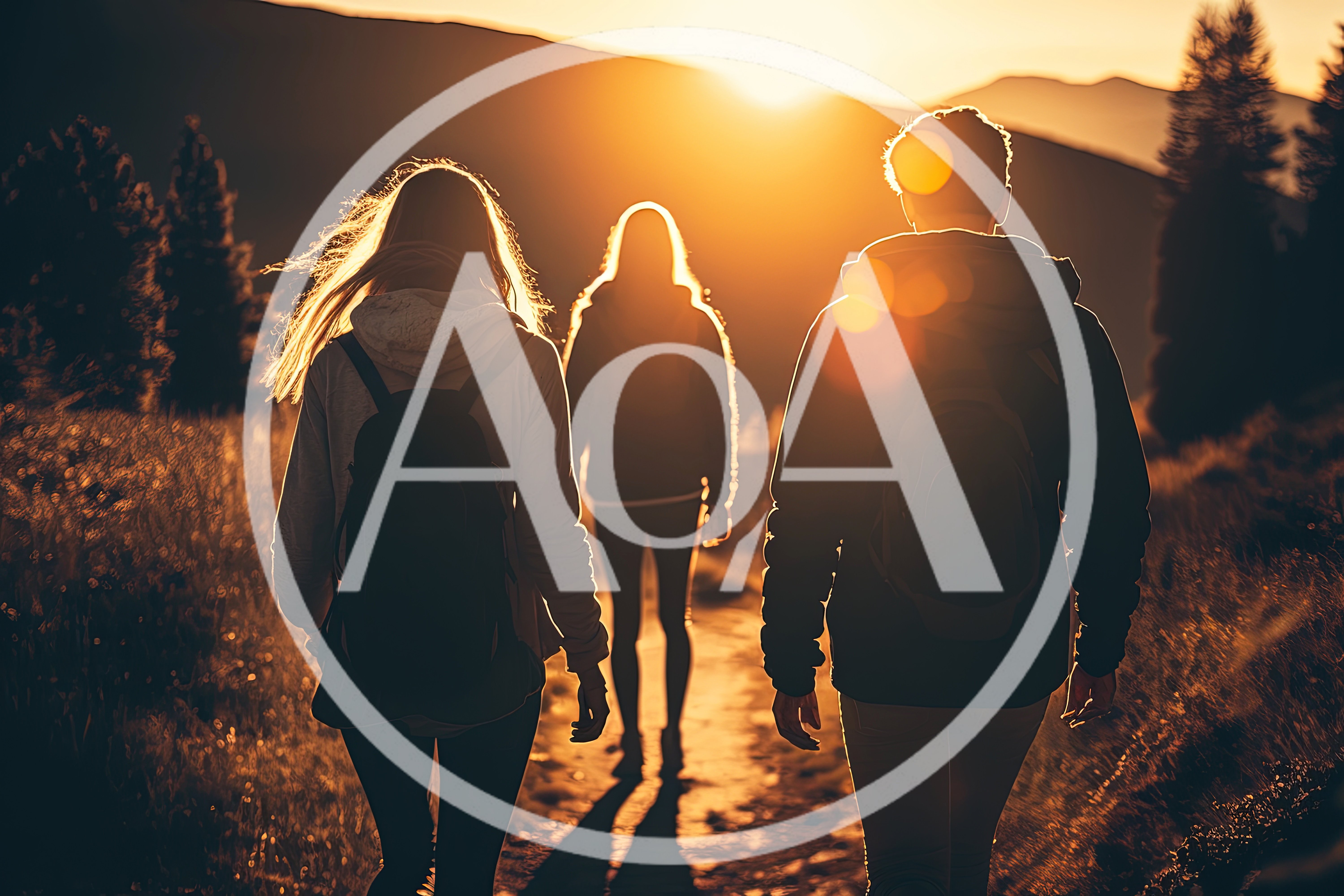 Three Hikers Walking Along A Mountain Trail At Sunset