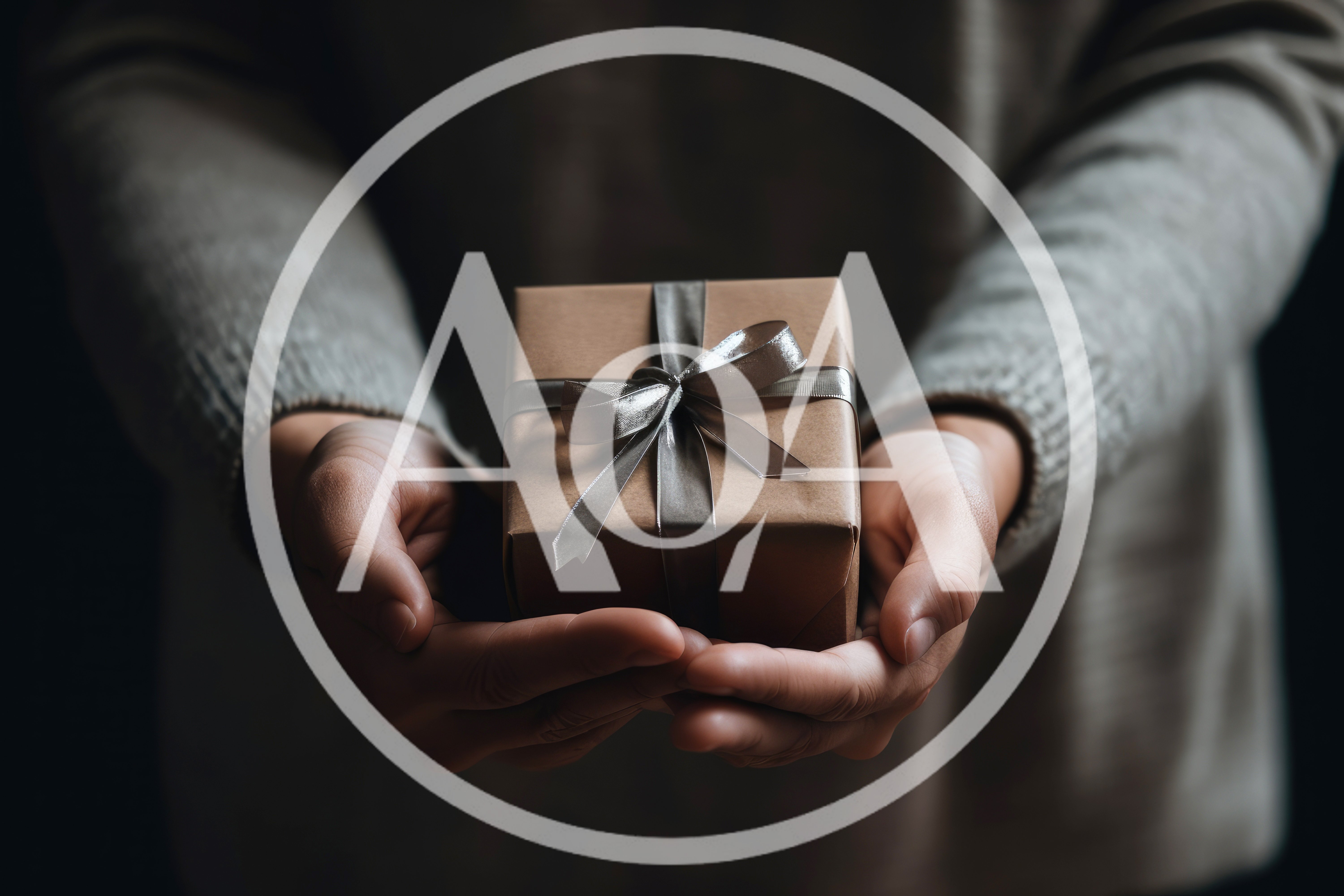 Person Holding A Small Gift Wrapped In Brown Paper