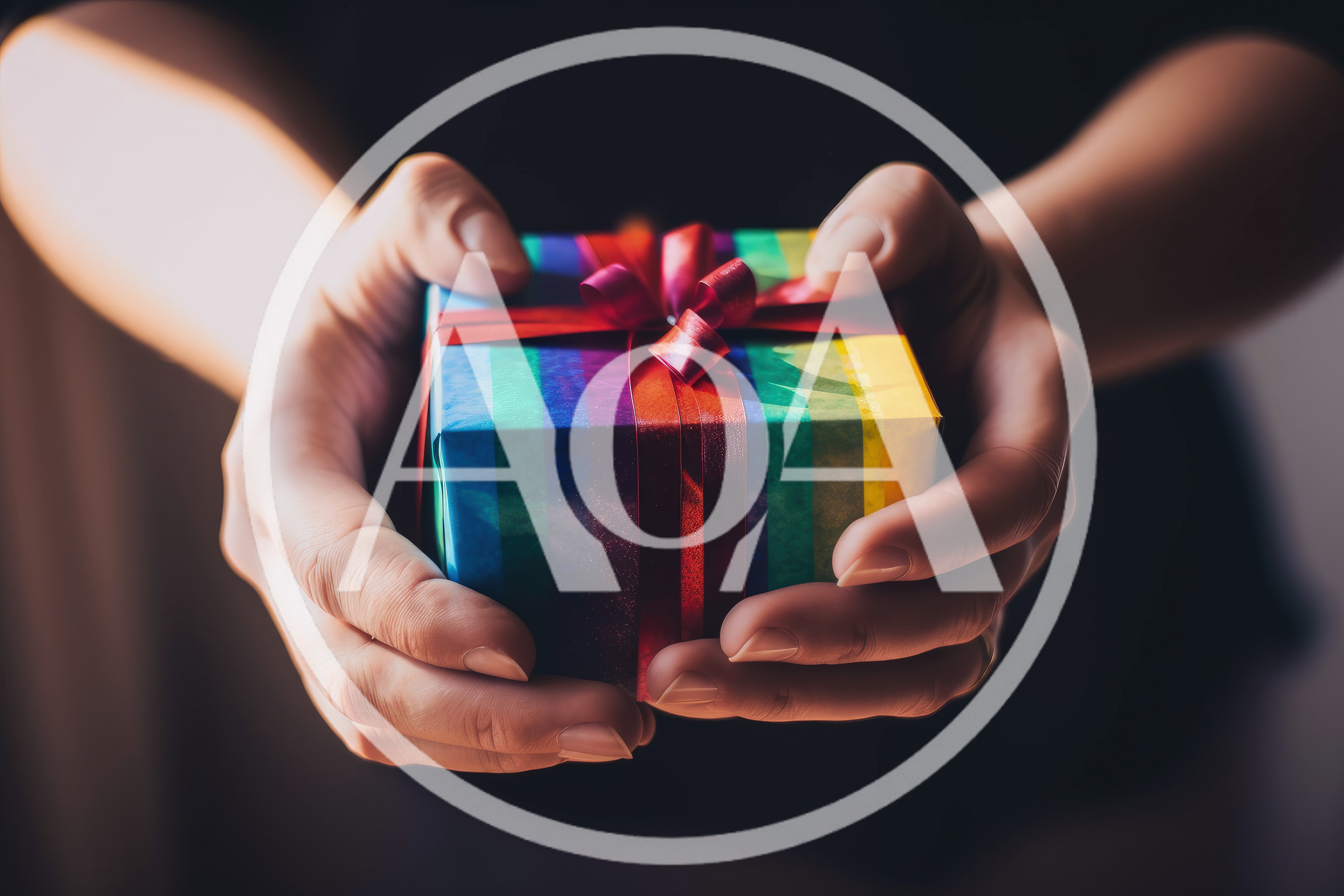 Person Holding A Rainbow Gift Box