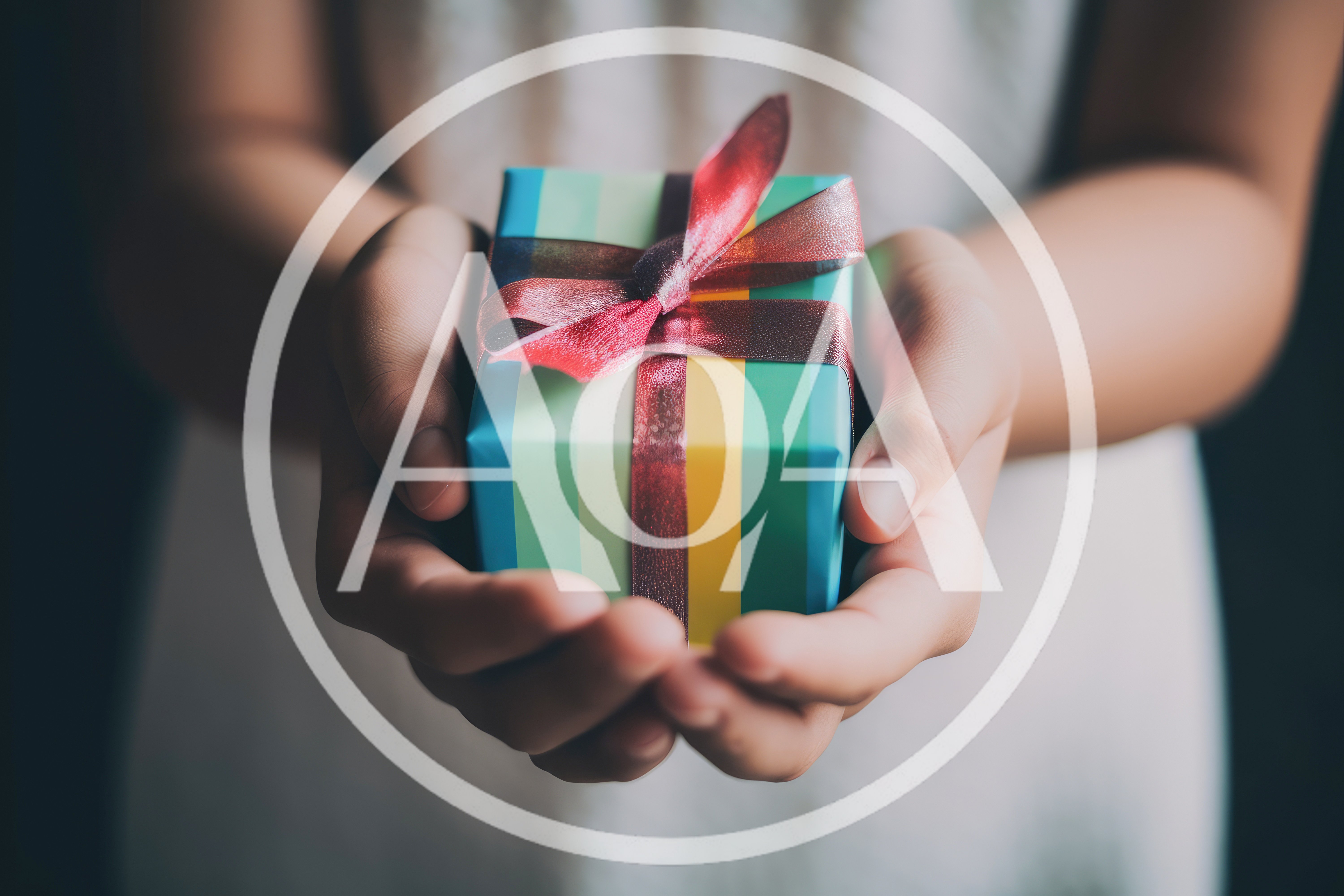 Person Holding A Small Gift Box With Ribbon