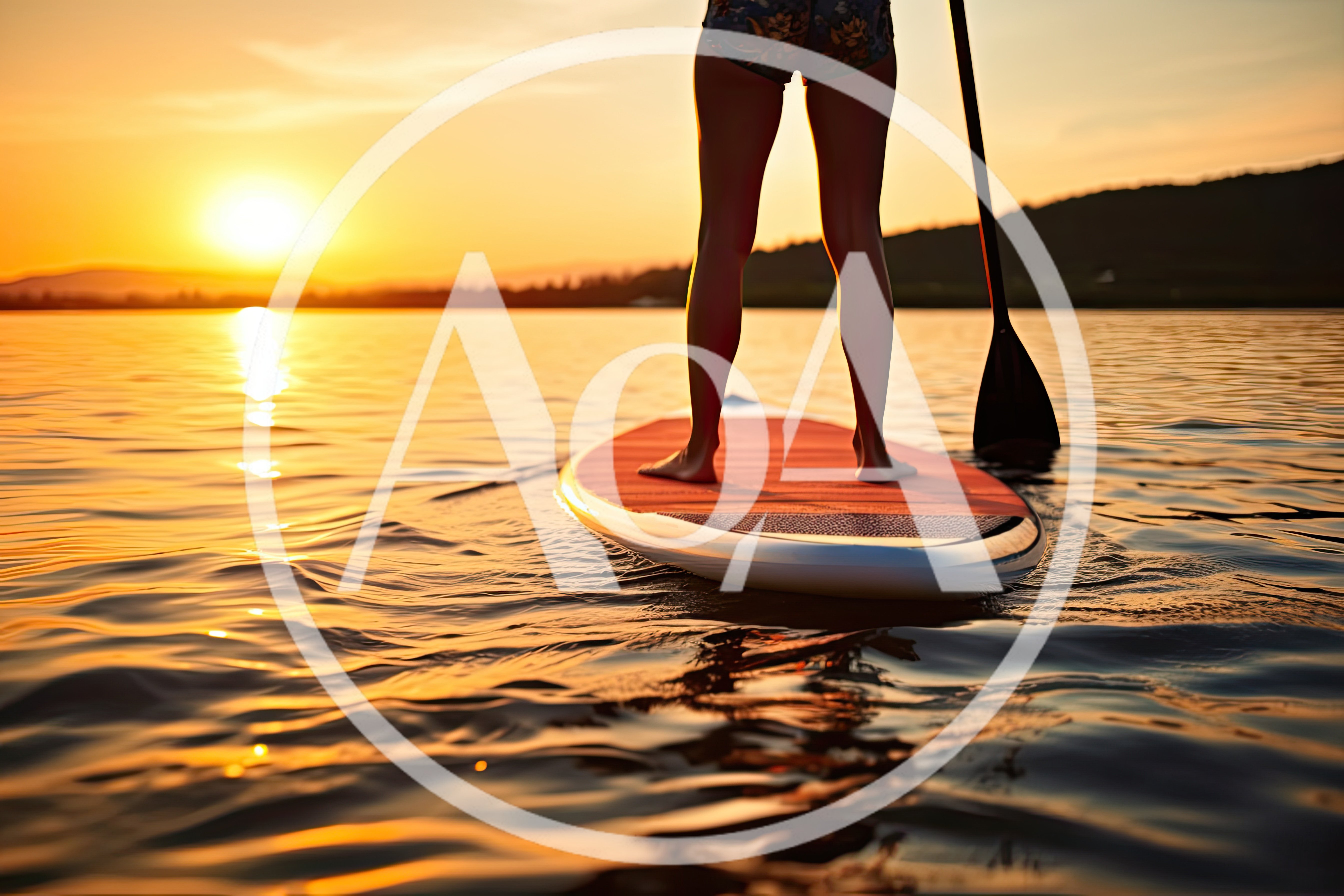 Woman Paddleboarding On A Lake At Sunset