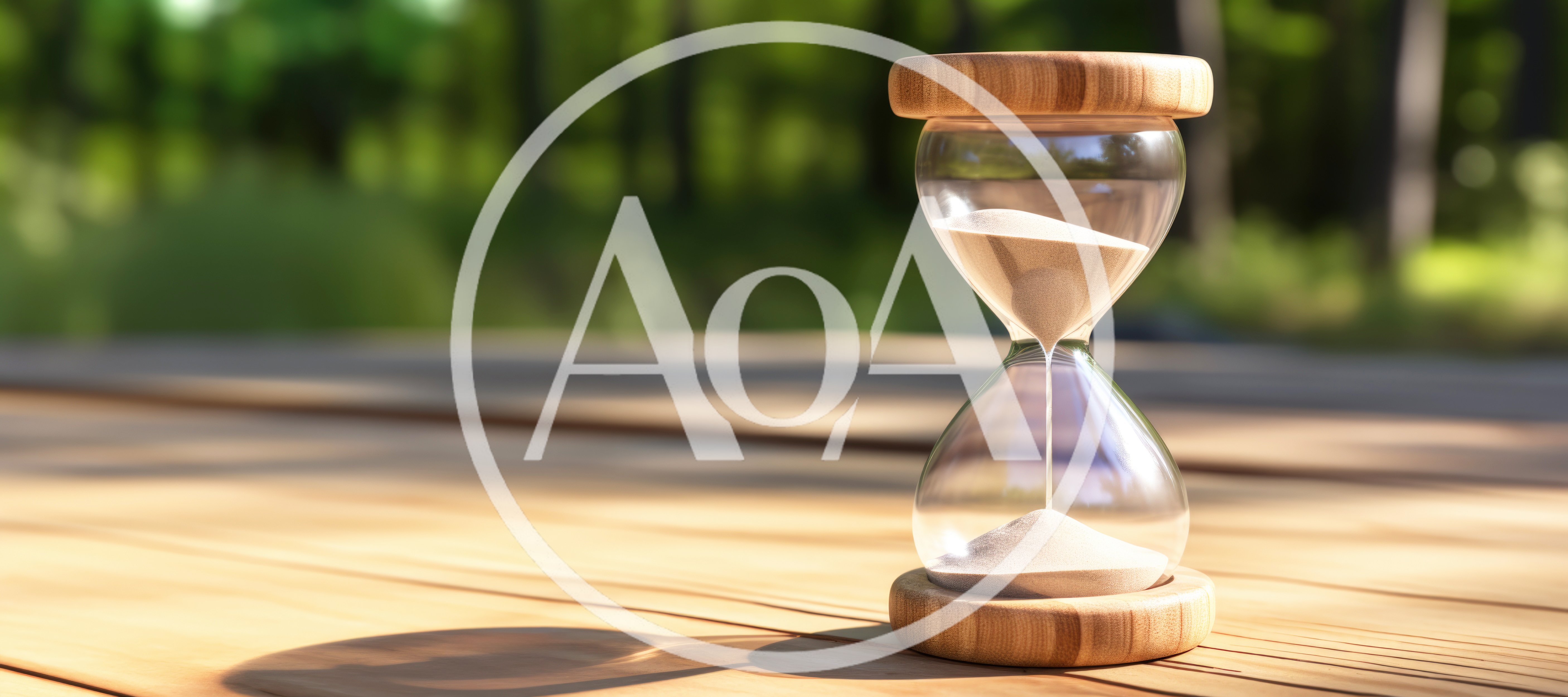 Wooden Hourglass With Flowing Sand On A Sunny Table