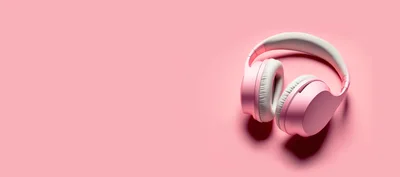 Pink Wireless Headphones On A Pink Background