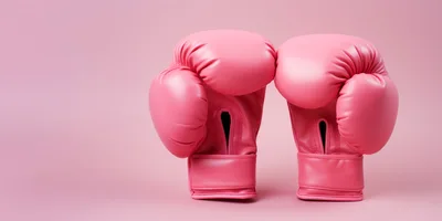 Pair Of Pink Boxing Gloves On Pink Background