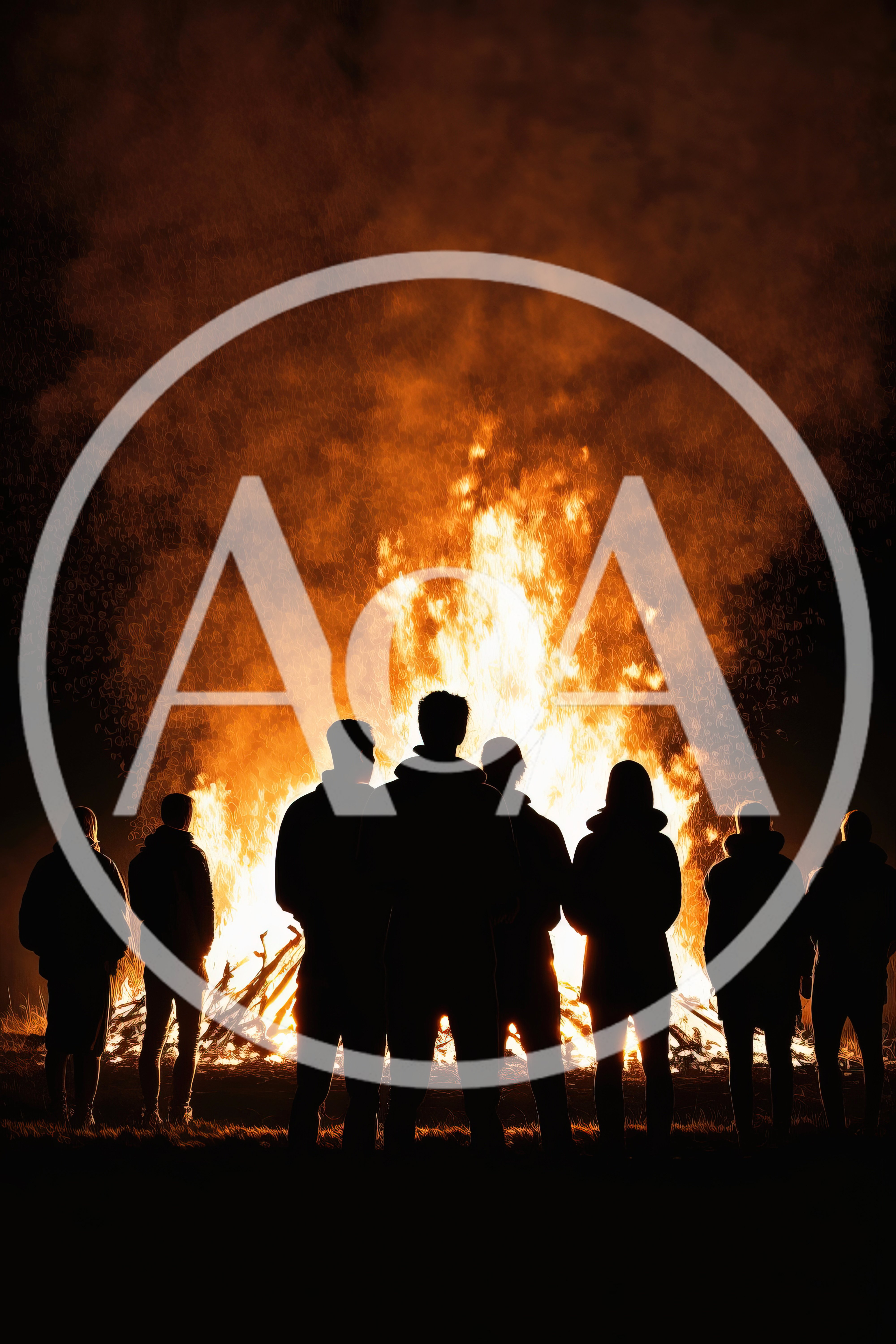 Silhouettes Of People Standing Before A Large Bonfire