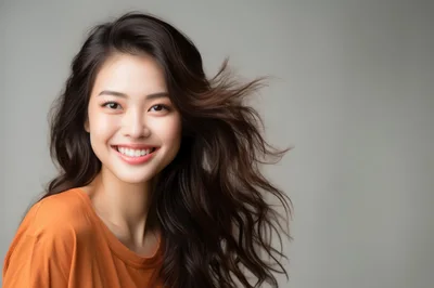 Portrait Of A Smiling Young Asian Woman