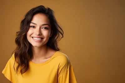 Portrait Of A Smiling Young Woman In Yellow