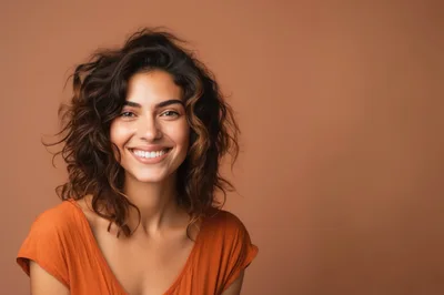 Portrait Of A Smiling Woman With Curly Hair