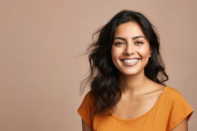 Portrait Of A Smiling Young Woman With Wavy Hair