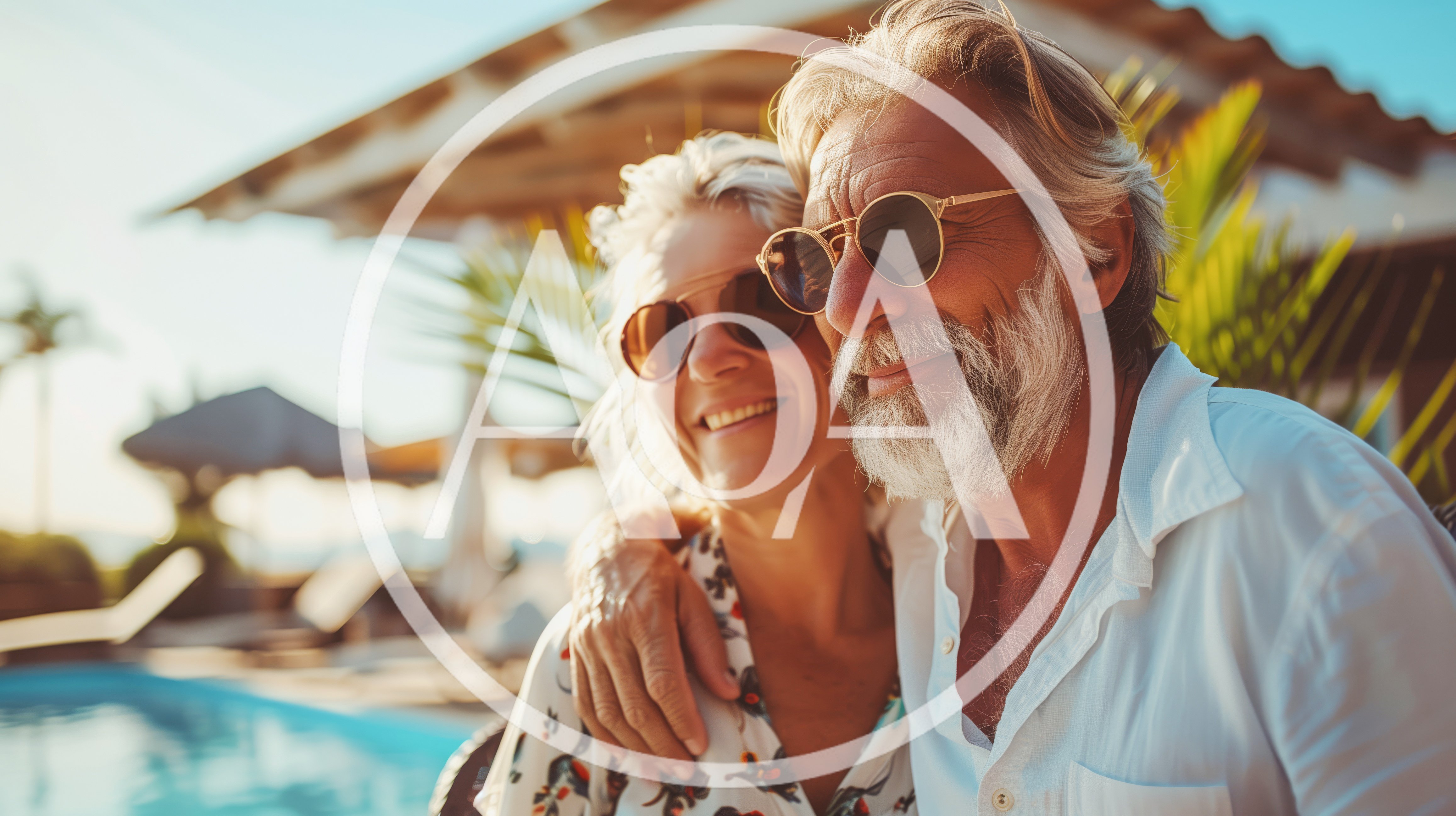 Happy Senior Couple Relaxing Together By A Sunny Pool
