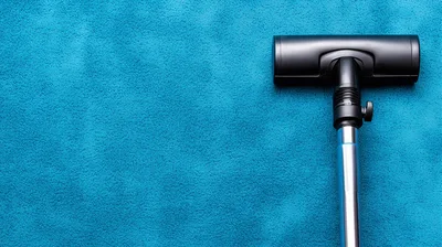 Vacuum Cleaner Head Cleaning A Blue Carpet Surface