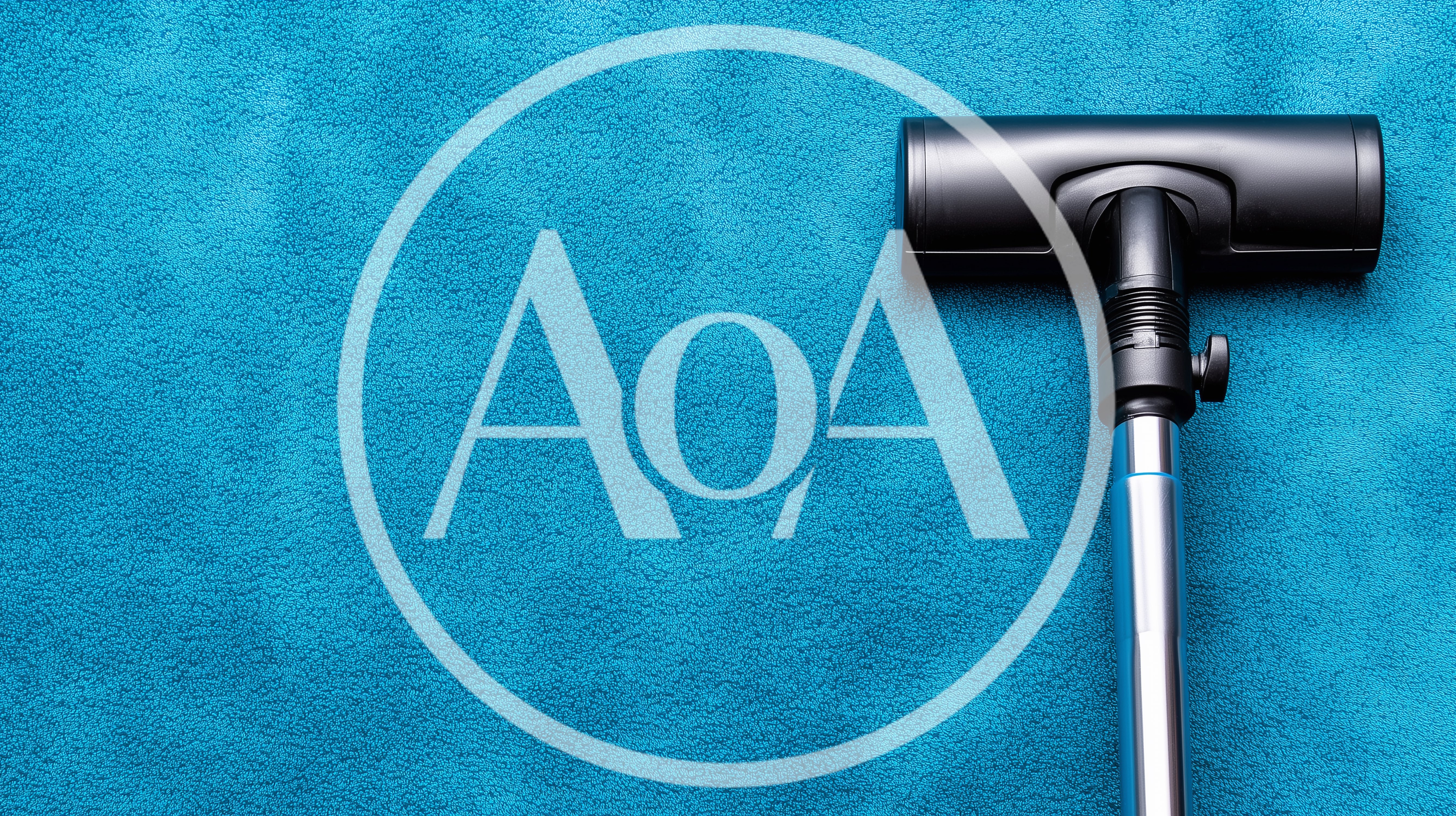 Vacuum Cleaner Head Cleaning A Blue Carpet Surface
