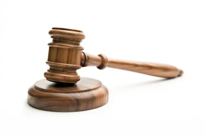 Wooden Judge Gavel Resting On A Sounding Block