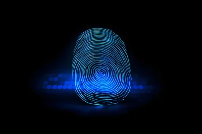 Glowing Digital Fingerprint Scan Over Computer Keyboard