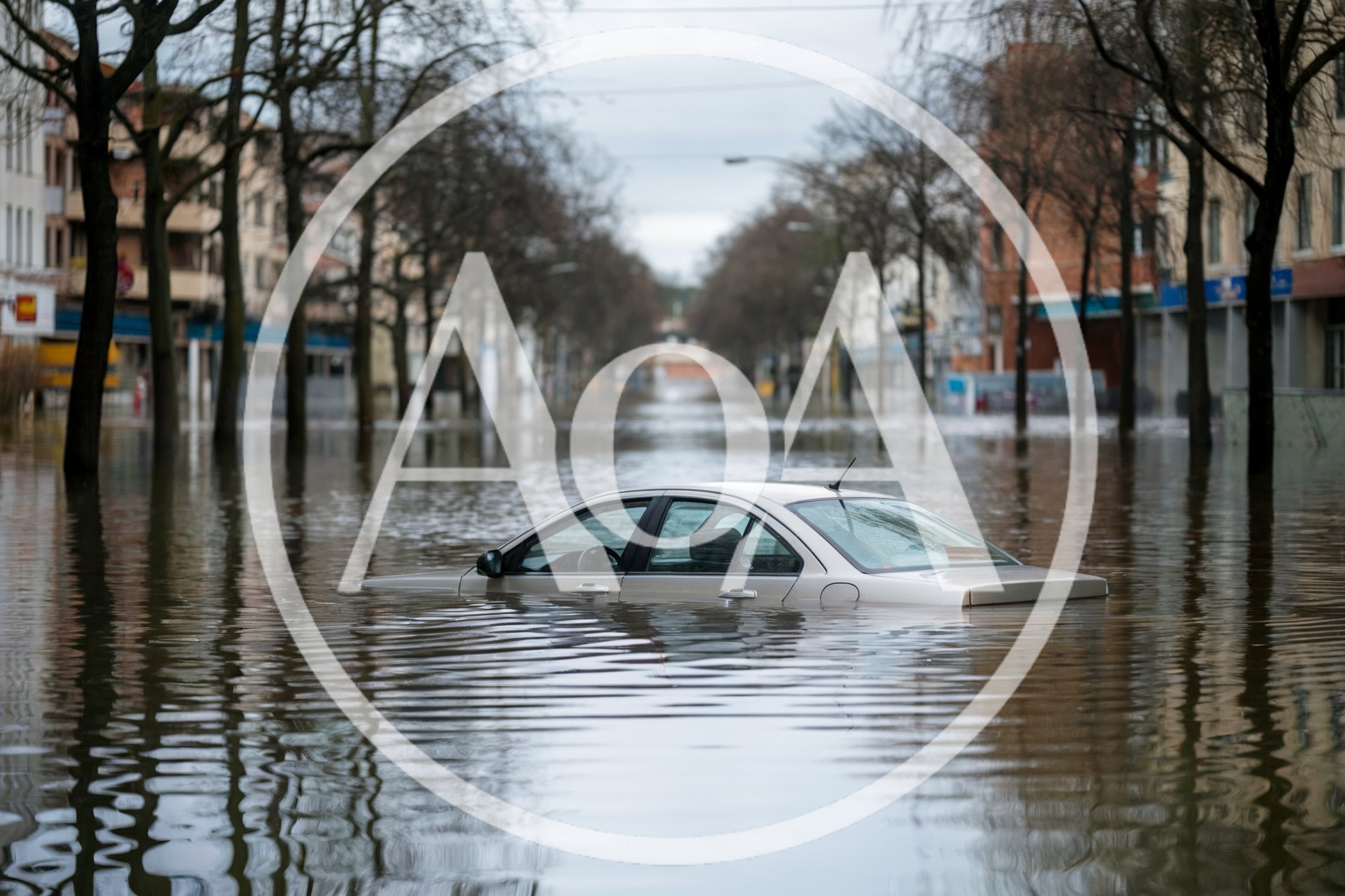 Submerged Sedan Car In Flooded City Street