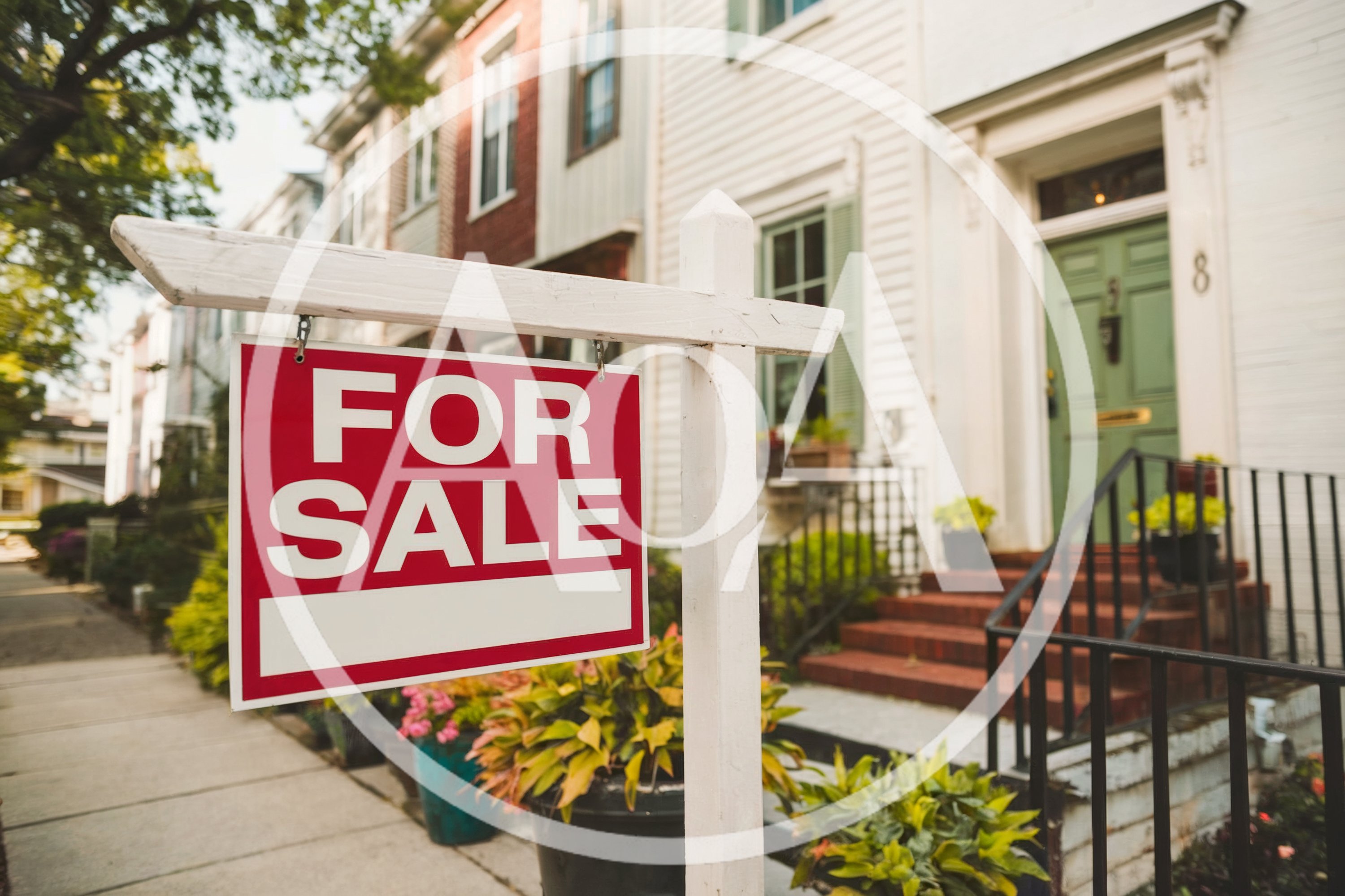 For Sale Real Estate Sign In Front Of Townhouse
