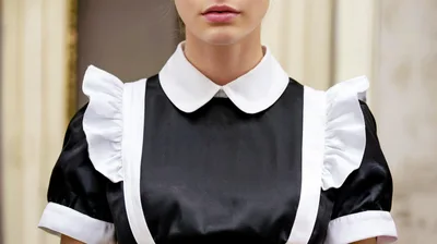 Close Up Of A Woman Wearing A Maid Costume